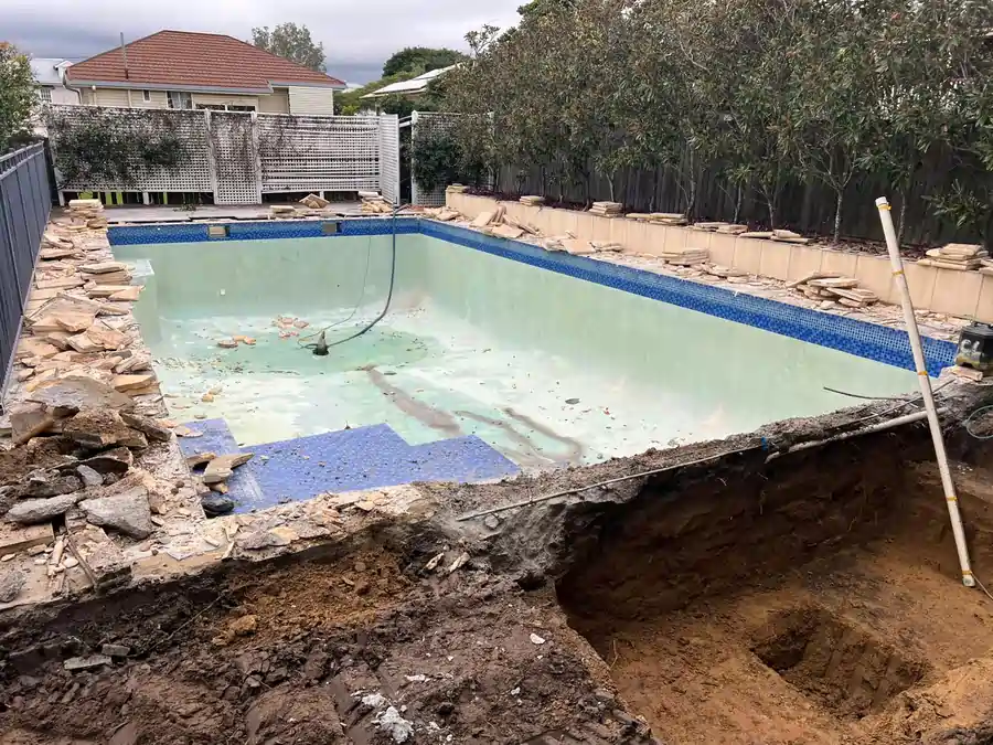 Newly renovated concrete swimming pool in Brisbane by CL Pools featuring modern tiling and resurfacing